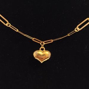 18 k real saudi gold paperclip with heart center .Necklace is 18 inches